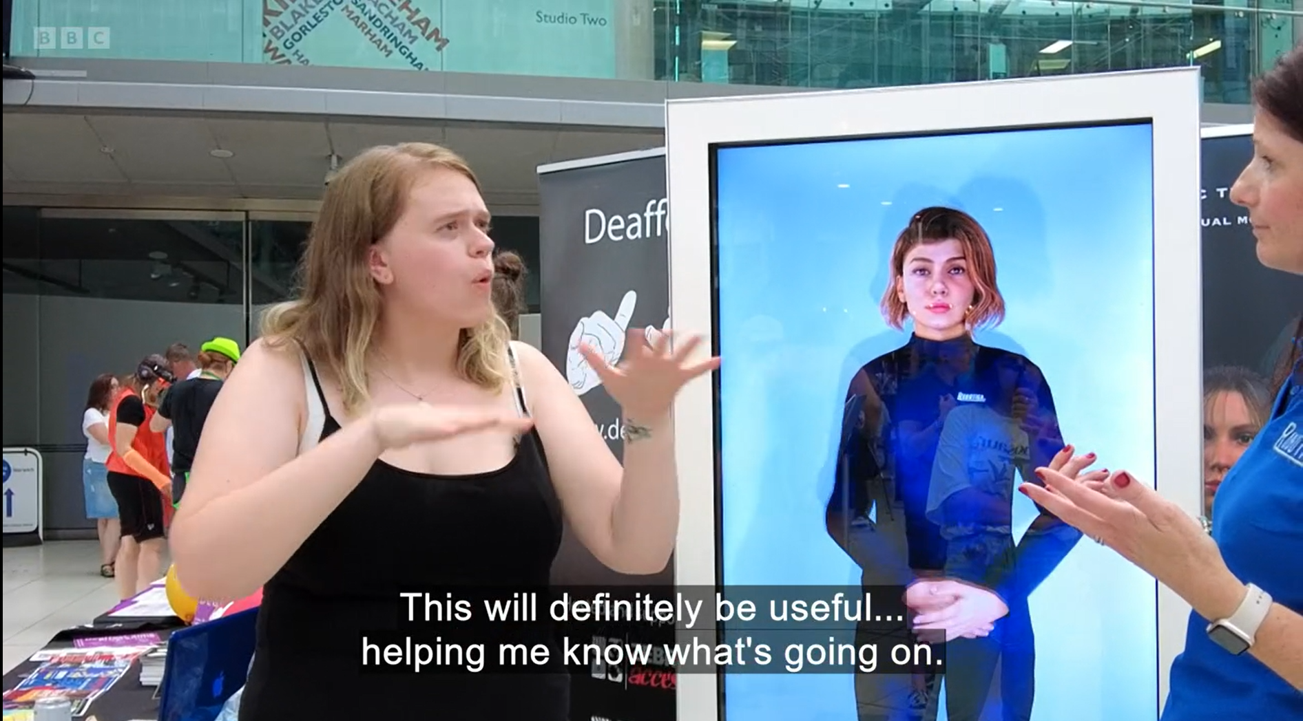 Lara Scott speaks to Catherine Cooper at the Norfolk Deaf Festival, signing "This will definitely be useful"